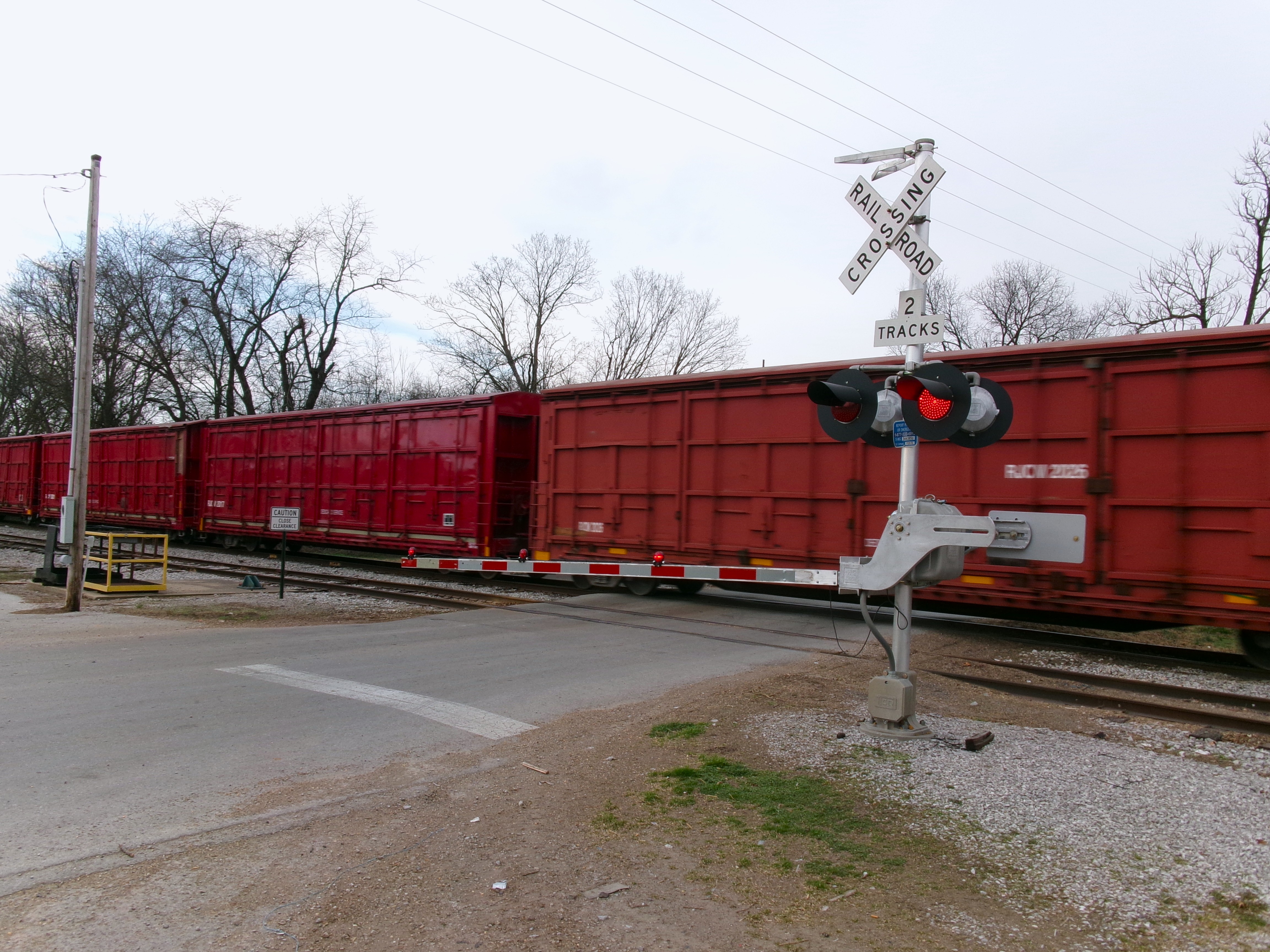 Picture of a train at a railroad crossing