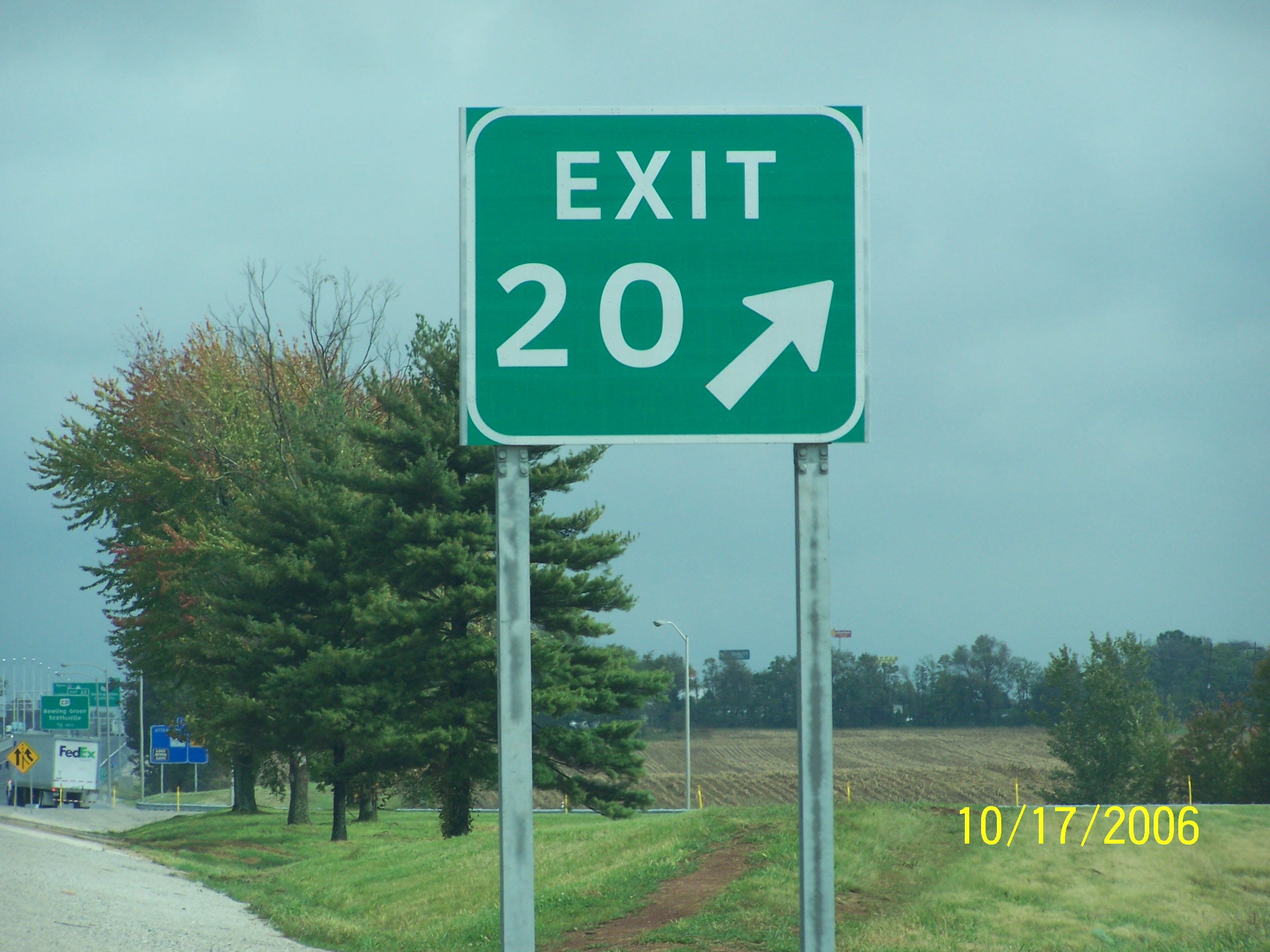 green guide sign exit 20 with white arrow